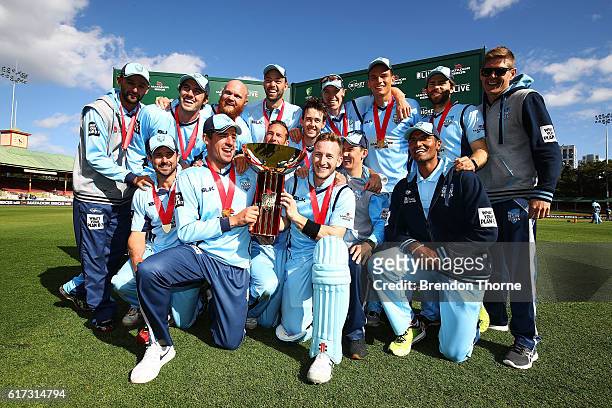Blues players celebrates with the Matador BBQs One Day Cup after victory in the Matador BBQs One Day Cup Final match between Queensland and New South...