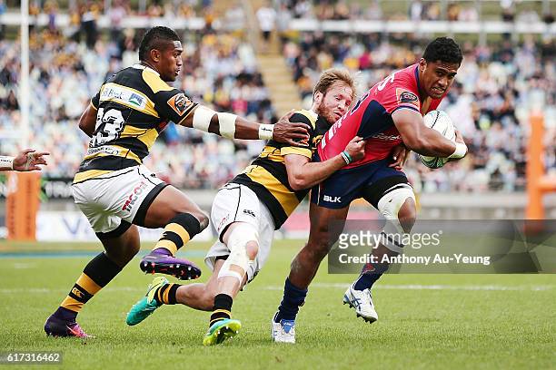 Viliami Lolohea of Tasman on the charge against Marty McKenzie and Waisake Naholo of Taranaki during the Mitre 10 Cup Semi Final match between...