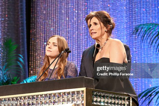 Actors Tara Lynne Barr, Tommy Dewey and Michaela Watkins speak onstage during the Environmental Media Association 26th Annual EMA Awards Presented By...