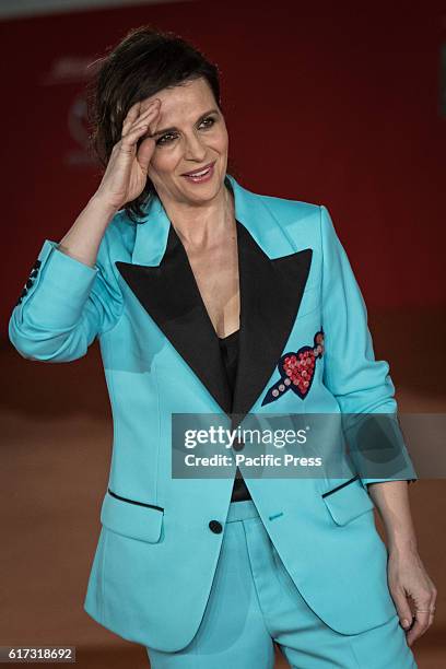 Juliette Binoche walk a red carpet for 'The English Patient - Il Paziente Inglese' during the 11th Rome Film Festival at Auditorium Parco Della...