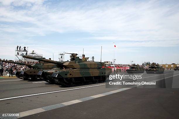 Japan Ground Self-Defense Force battle tanks move during the annual review at the Japan Ground Self-Defense Force Camp Asaka on October 23, 2016 in...