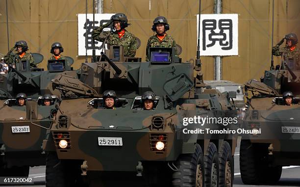 Japan Ground Self-Defense Force Type 10 battle tanks move during the annual review at the Japan Ground Self-Defense Force Camp Asaka on October 23,...