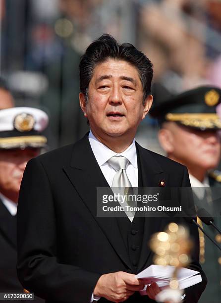 Japanese Prime Minister Shinzo Abe speaks during the annual review of the Self Defense Forces at the Japan Ground Self-Defense Force Camp Asaka on...