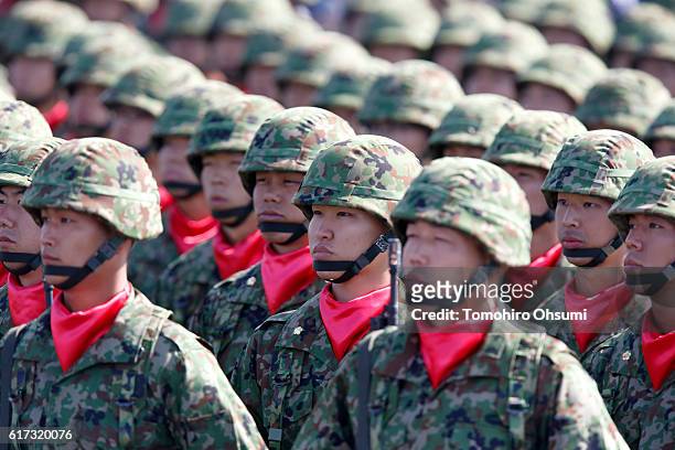 Members of the the Japan Ground Self-Defense Force attend the annual review at the Japan Ground Self-Defense Force Camp Asaka on October 23, 2016 in...