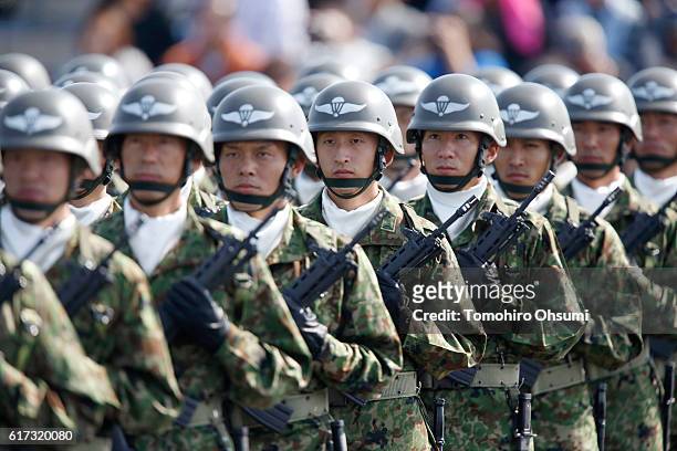 Members of the the Japan Ground Self-Defense Force march during the annual review at the Japan Ground Self-Defense Force Camp Asaka on October 23,...