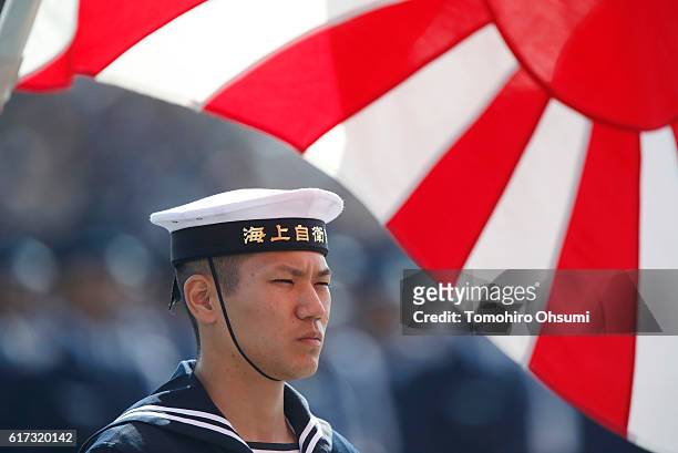 Member of the the Japan Maritime Self-Defense Force attends the annual review at the Japan Ground Self-Defense Force Camp Asaka on October 23, 2016...