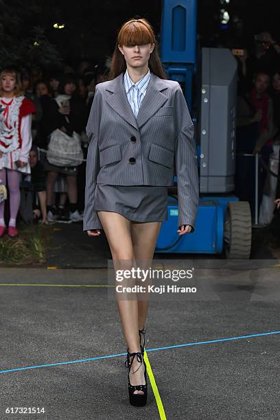 Model showcases designs on the runway during the MIKIO SAKABE show as part of Amazon Fashion Week TOKYO 2017 S/S at the Miyashita Park on October 22,...