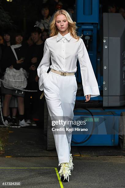 Model showcases designs on the runway during the MIKIO SAKABE show as part of Amazon Fashion Week TOKYO 2017 S/S at the Miyashita Park on October 22,...