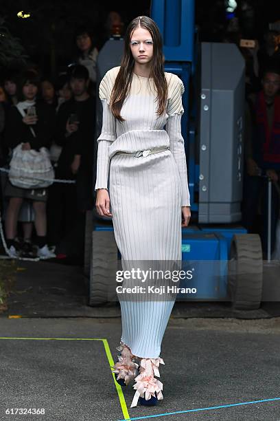 Model showcases designs on the runway during the MIKIO SAKABE show as part of Amazon Fashion Week TOKYO 2017 S/S at the Miyashita Park on October 22,...