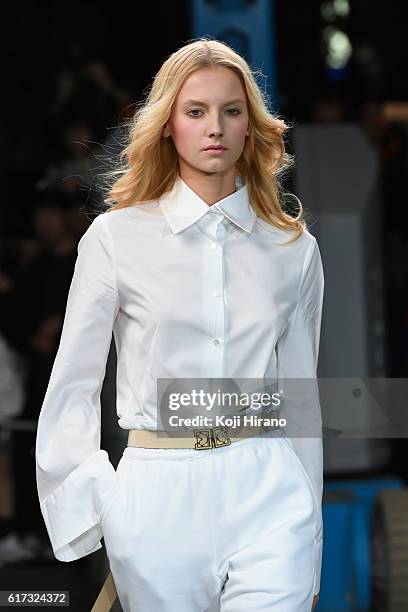 Model showcases designs on the runway during the MIKIO SAKABE show as part of Amazon Fashion Week TOKYO 2017 S/S at the Miyashita Park on October 22,...