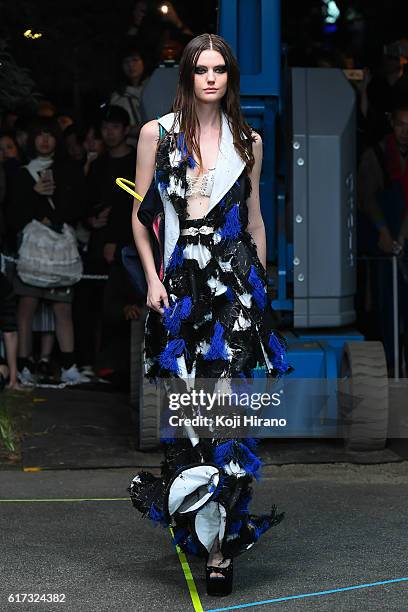 Model showcases designs on the runway during the MIKIO SAKABE show as part of Amazon Fashion Week TOKYO 2017 S/S at the Miyashita Park on October 22,...