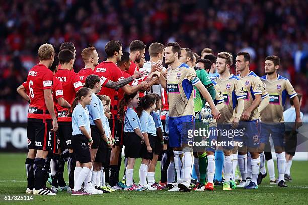 Teams shake hands prior to the round three A-League match between the Western Sydney Wanderers and the Newcastle Jets at Spotless Stadium on October...