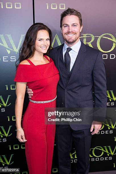 Actors Cassandra Jean and Stephen Amell arrive on the green carpet for the Celebration of the 100th Episode of CW's "Arrow" at the Fairmont Pacific...