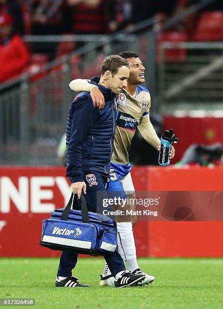 Andrew Nabbout of the Jets leanes the field with an injury during the round three A-League match between the Western Sydney Wanderers and the...