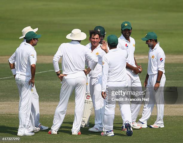 Yasir Shah of Pakistan celebrates with teammates after dismissing Shai Hope of West Indies during Day Three of the Second Test between Pakistan and...