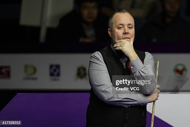 John Higgins of Scotland reacts during the first round match against Sydney Wilson of England on Day 1 of the International Championship 2016 at...
