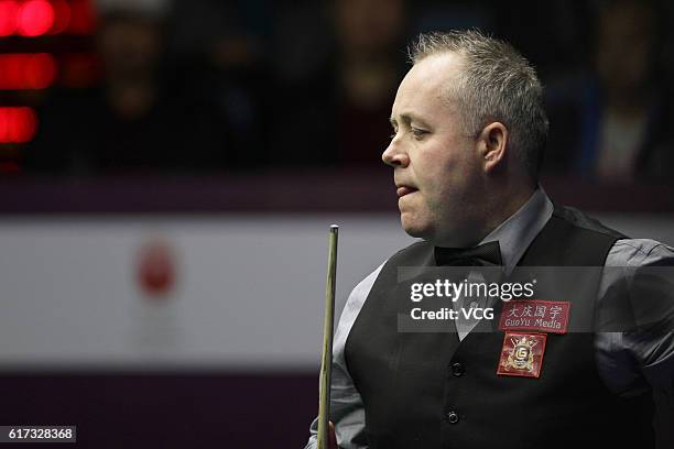 John Higgins of Scotland reacts during the first round match against Sydney Wilson of England on Day 1 of the International Championship 2016 at...