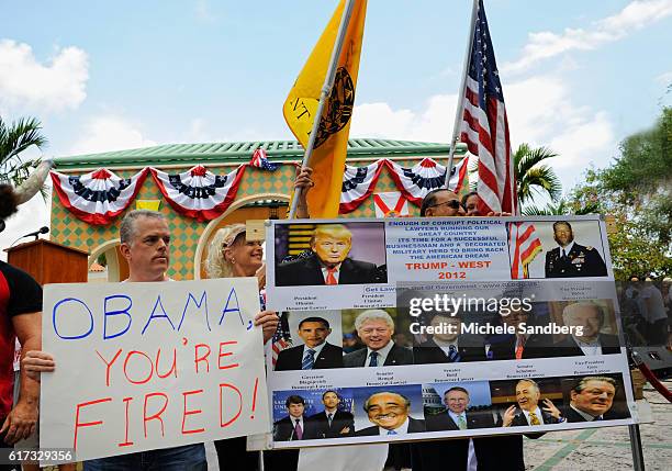 View of audience members and their signs as they attend the South Florida Tea Party's Tax Day event, Boca Raton, Florida, April 16, 2011. The event's...