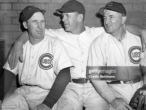 Coach Johnson, manager Charles Grimm, and Manager Stock of the Chicago Cubs.