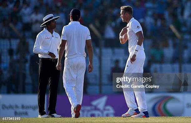 Stuart Broad of England argues with umpire Kumar Dharmasena during the 4th day of the 1st Test match between Bangladesh and England at Zohur Ahmed...