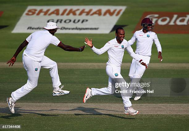 Kraigg Brathwaite and Jason Holder of West Indies celebrate during Day Three of the Second Test between Pakistan and West Indies at Zayed Cricket...