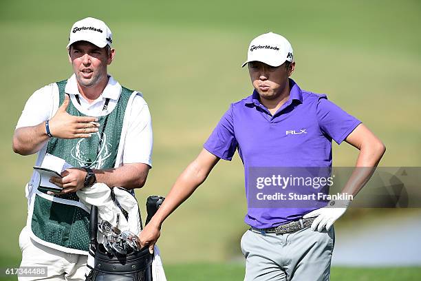 David Lipsky of USA waits with his caddie during day four of the Portugal Masters at Victoria Clube de Golfe on October 23, 2016 in Vilamoura,...