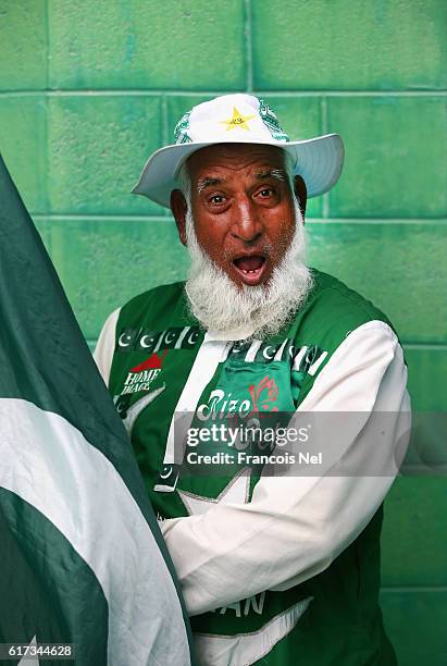 Pakistan fan poses during Day Three of the Second Test between Pakistan and West Indies at Zayed Cricket Stadium on October 23, 2016 in Abu Dhabi,...