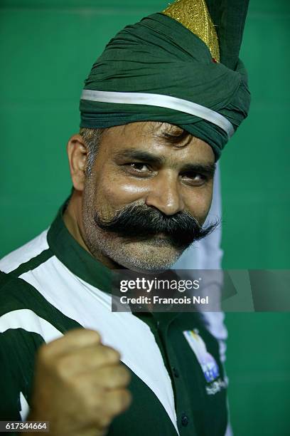 Pakistan fan poses during Day Three of the Second Test between Pakistan and West Indies at Zayed Cricket Stadium on October 23, 2016 in Abu Dhabi,...