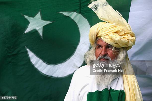 Pakistan fan poses during Day Three of the Second Test between Pakistan and West Indies at Zayed Cricket Stadium on October 23, 2016 in Abu Dhabi,...