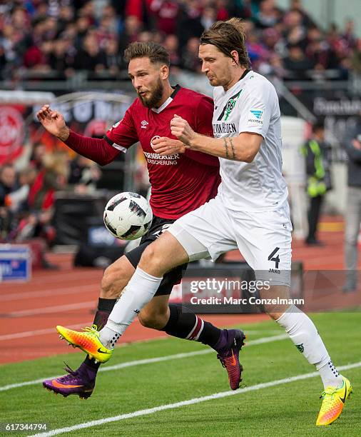 Tim Matavz of 1. FC Nuernberg challenges Stefan Strandberg of Hannover 96 during the Second Bundesliga match between 1. FC Nuernberg and Hannover 96...