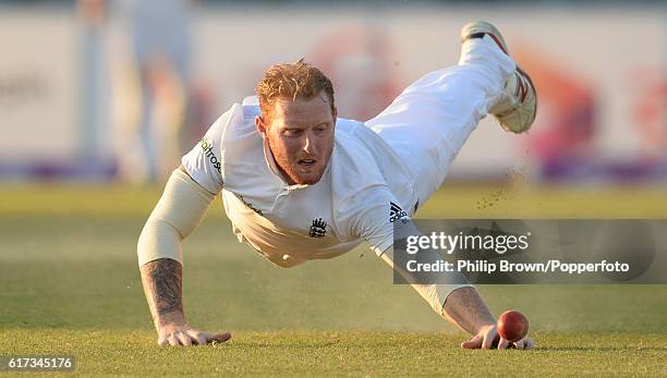 Ben Stokes tries to stop the ball during the fourth day of the first test match between Bangladesh and England at Zohur Ahmed Chowdhury Stadium on...