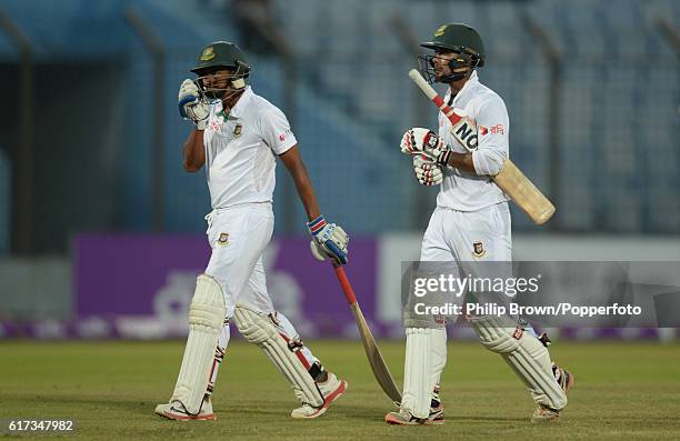 Sabbir Rahman and Taijul Islam leave the field at stumps on the fourth day of the first test match between Bangladesh and England at Zohur Ahmed...