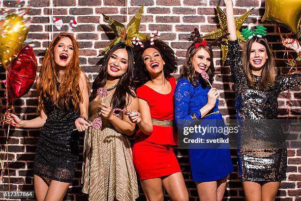 new year's party with girls. - girl gold dress stock pictures, royalty-free photos & images