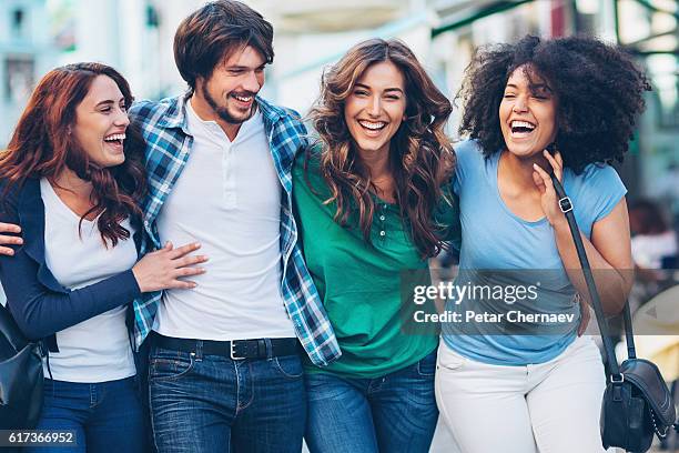 cheerful group on the street - man met een groep vrouwen stockfoto's en -beelden