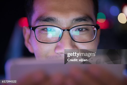 Man Using Cell Phone Light Face Closeup Man Using Mobile Phone At Night High-Res Stock Photo - Getty Images