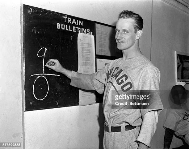 Hank Borowy, right-handed ace of the Chicago Cubs chalks up the Cubs 9-0 victory score in his dressing room at Briggs Stadium after his team had...