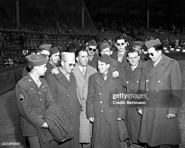 Sixteen blind veterans of the war are shown being welcomed at Briggs stadium by Senator ‘Happy’ Chandler, high commissioner of baseball, as they...