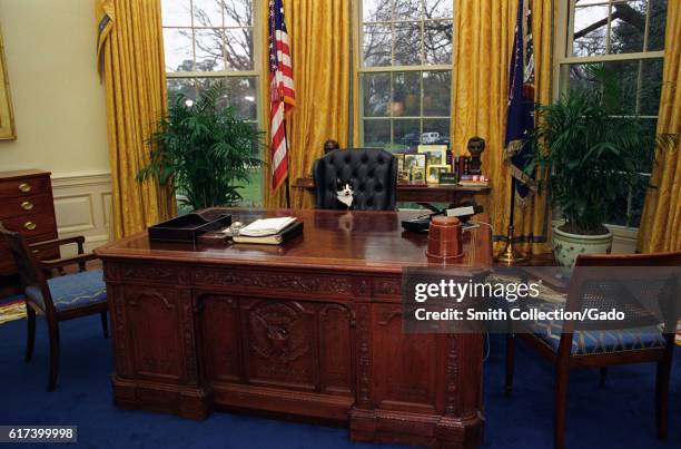 Socks the Cat, the First Pet of President Bill Clinton and First Wife Hillary Rodham Clinton, with black fur, white face, and amber eyes, seated at...