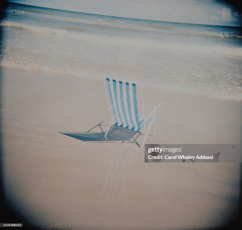 Empty Deck Chair on Beach