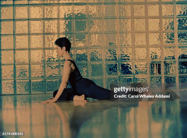 woman in yoga position - carol addassi stock-fotos und bilder