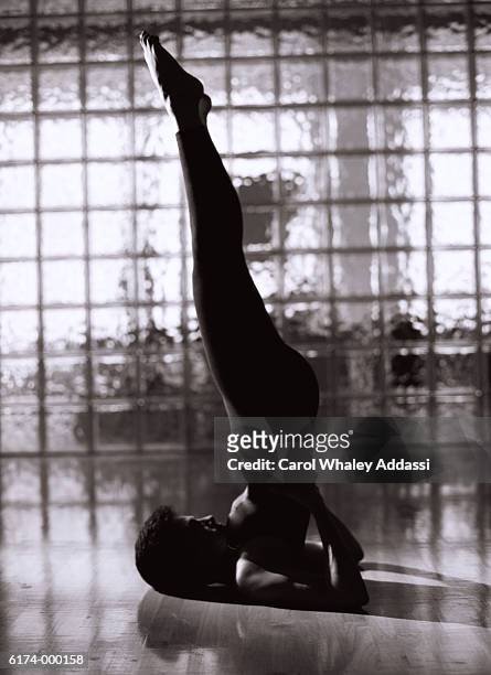 woman performs yoga - carol addassi stock pictures, royalty-free photos & images