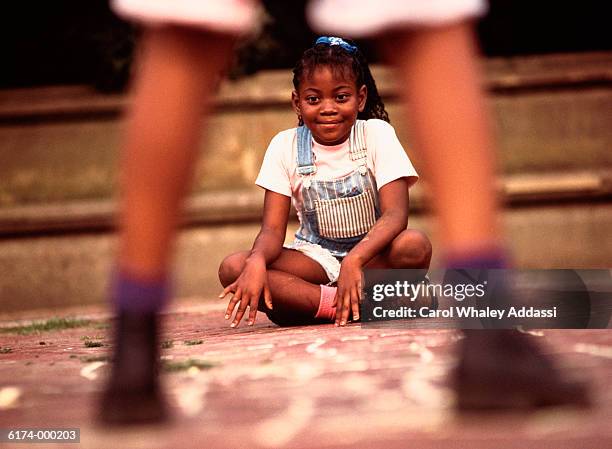 two girls playing hopscotch - carol addassi stock pictures, royalty-free photos & images