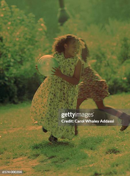 girls playing with ball - carol addassi stock-fotos und bilder