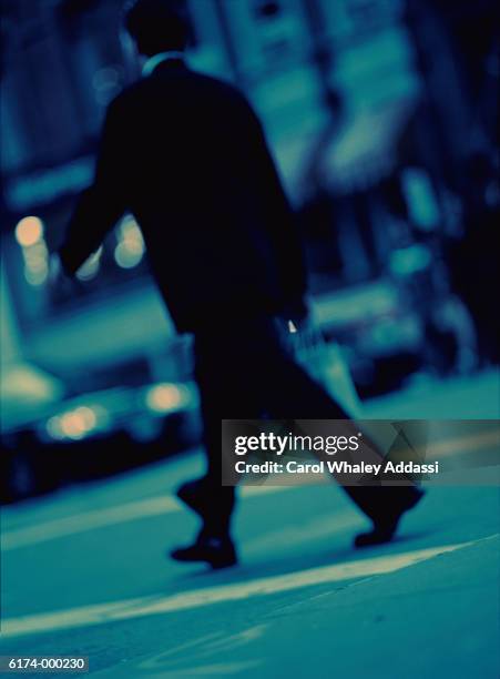 businessman crossing street - carol addassi stock-fotos und bilder