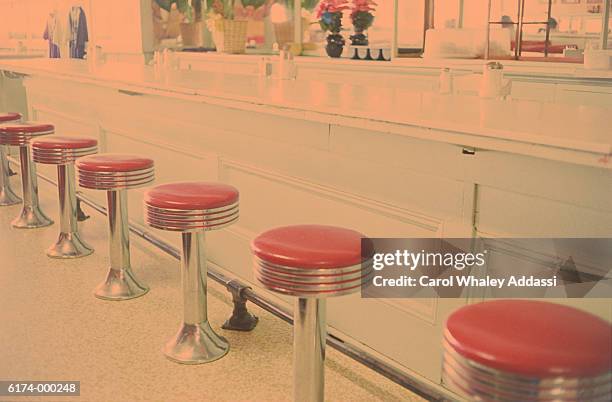 stools at bar counter - carol addassi stock-fotos und bilder