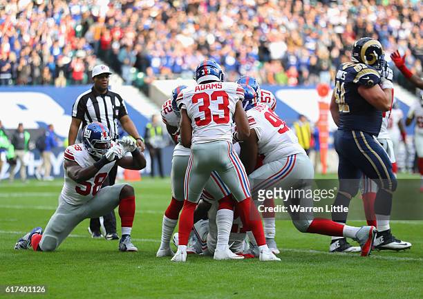 Landon Collins of the New York Giants scores a touchdown during the NFL International Series match between New York Giants and Los Angeles Rams at...