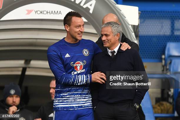 John Terry of Chelsea greets Jose Mourinho, Manager of Manchester United prior to the Premier League match between Chelsea and Manchester United at...