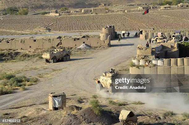 Armored Vehicles belonging to the Afghani army are seen after they retook Ghormach district of Faryab province in Afghanistan on October 23, 2016.