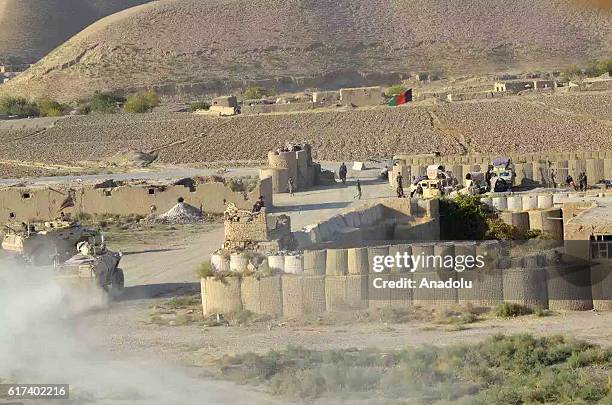 Armored Vehicles belonging to the Afghani army are seen after they retook Ghormach district of Faryab province in Afghanistan on October 23, 2016.