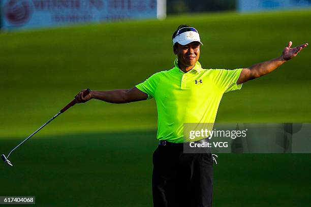 Retired Chinese skater Zhao Hongbo celebrates in action during round 2 on the second day of the World Celebrity Pro-Am 2016 Mission Hills China Golf...